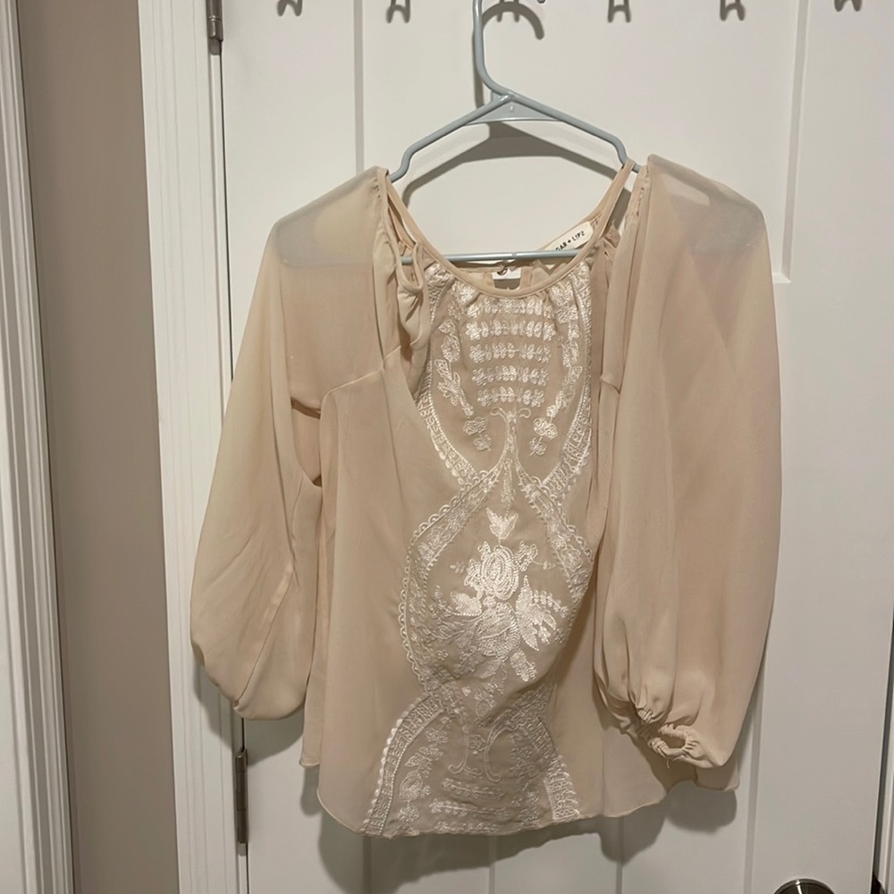 Cream shoulder display, bohemian print on the front.  Fun and flirty
